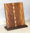 Figured cherry mounting with inlay, walnut base